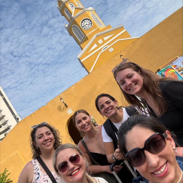 AIJA Women Network members in front of a clock tower